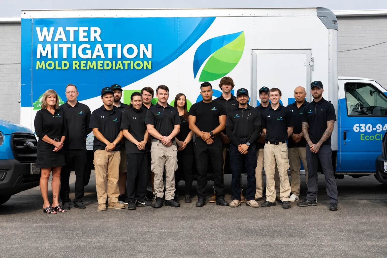 The EcoClean team standing in front of the service fleet.